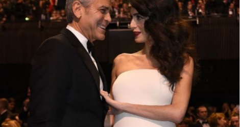 L'acteur américain George Clooney (g) et son épouse Amal Clooney, le 24 février 2017 à Paris bertrand GUAY  /  AFP/Archives
