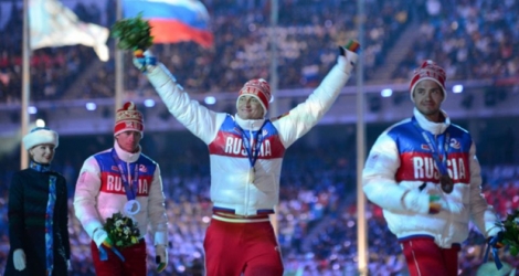 Podium 100% russe (de g à d: Maxim Vyleghzanin, Alexander Legkov et Ilia Chernousov) vainqueur du 50km Mass Start aux JO d'hiver de Sotchi, le 23 février 2014.