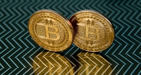 Le bitcoin, une devise virtuelle décrite comme une «bulle spéculative» susceptible d'«imploser».