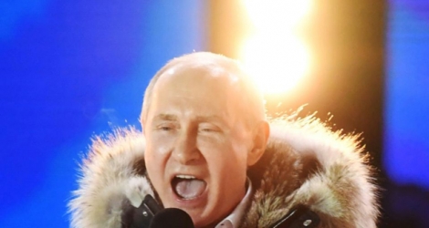 Le président russe Vladimir Poutine lors d'un rassemblement et un concert à Moscou pour le 4e anniversaire de l'annexion de la Crimée, le 18 mars 2018 