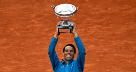 L'Espagnol Rafael Nadal remporte son onzième Roland-Garros aux dépens de l'Autrichien Dominic Thiem en finale, le 10 juin 2018.
