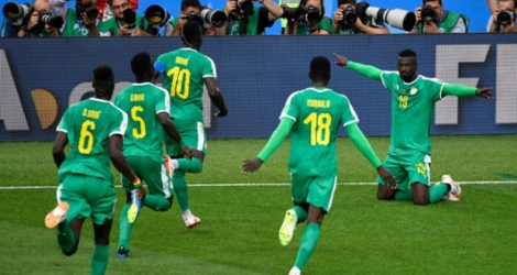 La joie des Sénégalais après le but de Mbaye Niang (d) face à la Pologne lors du Mondial, le 19 juin 2018 à Moscou.