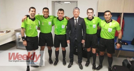 Alain Lim Kee Cheong (middle) with match officials for Sweden vs. South Korea.