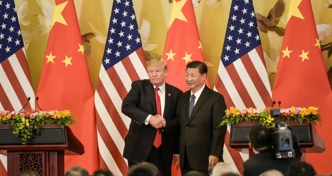 Les présidents américain Donald Trump (g) et chinois Xi Jinping, à Pékin.