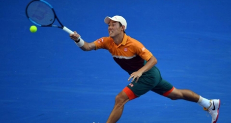 Le Japonais Kei Nishikori lors de son 8e de finale de l'Open d'Australie face à l'Espagnol Pablo Carreno Busta, à Melbourne, le 21 janvier 2018 