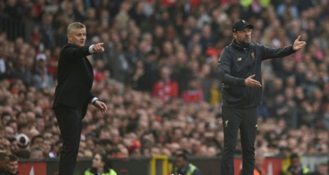 Les entraîneurs de Manchester United Ole Gunnar Solskjaer et de Liverpool Jürgen Klopp, le 24 février 2019 à Old Trafford.