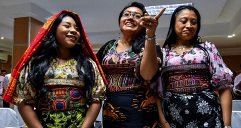 Guna indigenous women from Panama wearing traditional Mola designs at a press conference in Panama City to raise awareness of their intellectual property case against US Sportswear giant Nike.