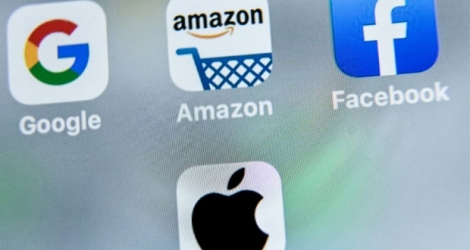 Les logos des géants américains du numérique, Google, Apple, Facebook et Amazon visés par la taxe française, dite 
