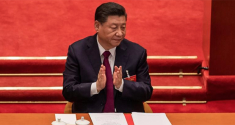 Le président chinois Xi Jinping au Palais du Peuple, le 11 mars 2021 à Pékin. afp.com - NICOLAS ASFOURI