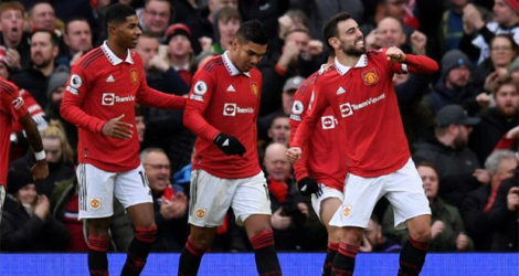 La joie des joueurs de Manchester United après un but de Bruno Fernandes contre Manchester City, le 14 janvier 2023 à Old Trafford.