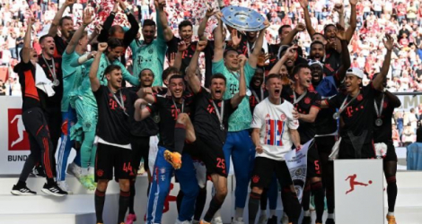 Les joueurs du Bayern Munich fêtent leur 11e titre consécutif de champion d'Allemagne, après leur succès à Cologne, le 27 mai 2023. AFP Christof Stache