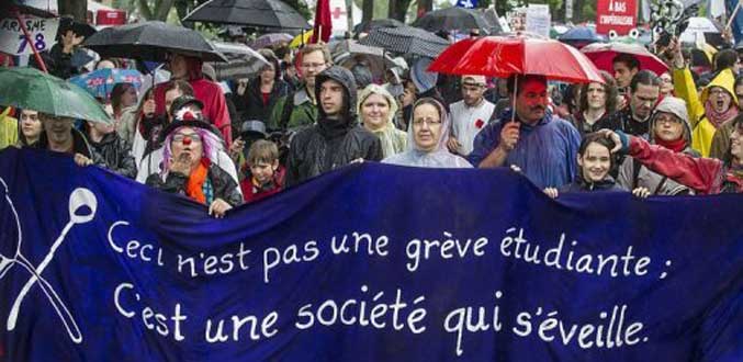 Conflit étudiant au Québec: des milliers de manifestants bravent la pluie