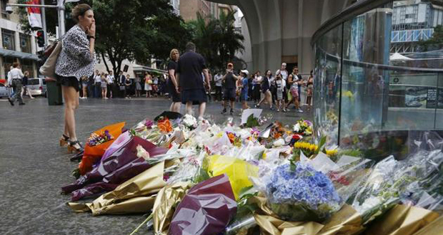 Recueillement et interrogations à Sydney après la prise d'otages